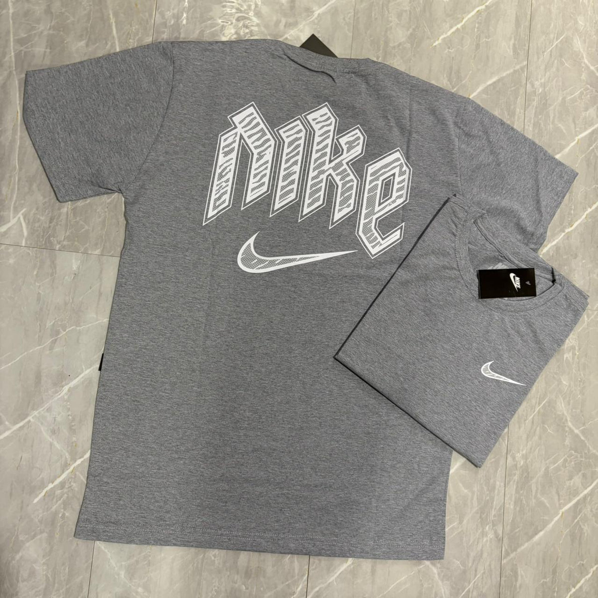 Camiseta Grife NIKE Cinza Mescla com Swoosh Branco Bordado